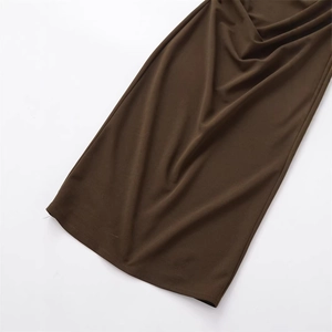 Chic dark brown slim-fit dress with elegant knitted texture and natural drape effect