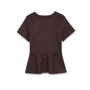 Detailed view of dark coffee knit top with peplum hem and gold buckle thin belt