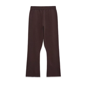 Detailed macro of dark brown ribbed knit flare pants with elastic high waist