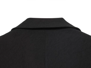 Detailed close-up of the black twill fabric and refined stitching on the blazer neckline