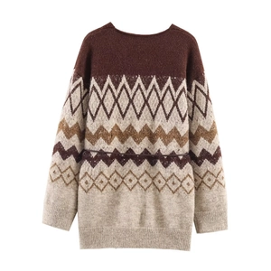 Detailed macro view of vintage geometric knit pattern on women sweater with waist belt