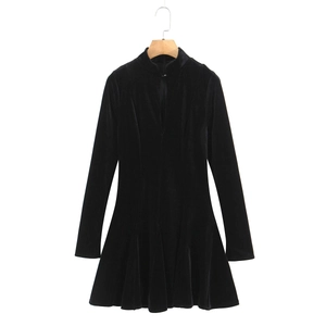 Detail of black velvet mini dress featuring a small stand collar and V-neck cutout design