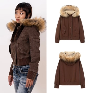Detail of hooded bomber jacket featuring detachable faux fur collar and fleece lining