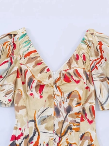 Floral V-neck puff sleeve dress with vintage abstract print and cinched waist design