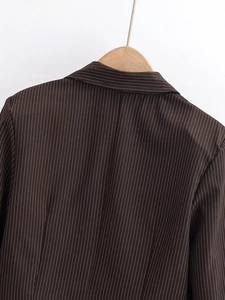 Detailed back view of striped short blazer showing clean tailoring and pinstripe pattern