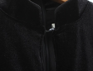 Detail of black velvet dress neckline with invisible zipper and small button closure