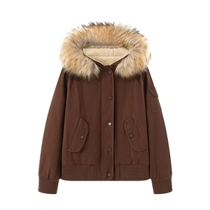 Detail of winter jacket with removable faux fur collar and warm sherpa lining inside