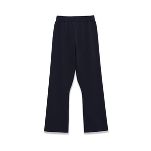 Close-up of black ribbed knit wide-leg pants with elastic waist and textured fabric
