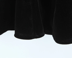 Macro detail of high-quality black velvet fabric texture and professional hem stitching