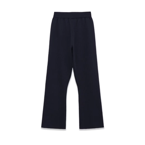 Detail of navy blue ribbed knit trousers with elastic waistband and straight leg fit