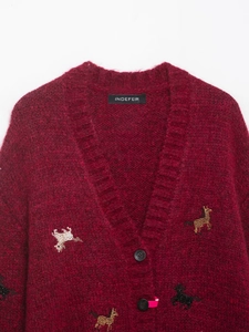 Detail of burgundy mohair cardigan featuring horse beads and V-neck button design