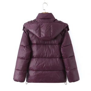 Detailed back view of a glossy dark purple quilted winter coat with adjustable hem drawstrings