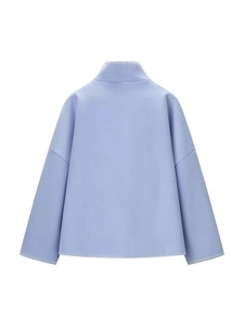 Back view of a light blue wool-like short jacket with white contrast stitching detail