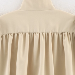 Chic apricot stand-collar jacket for women featuring detailed pleated back craftsmanship