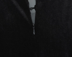 Macro detail of high-quality invisible zipper on black velvet slim fit dress