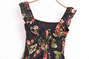 Detail of square neckline with ruffles and smocked back on vintage floral dress