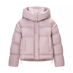 Close-up of pink hooded puffer jacket with white geometric circular patterns and metal buttons