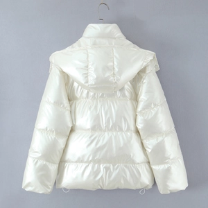 Detail view of pearl white glossy puffer jacket featuring horizontal stitching and hood