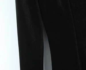 Macro shot of premium black velvet fabric texture showing soft and smooth fiber details
