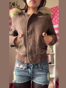 Detail of short brown utility jacket with faux fur collar and ribbed knit cuffs