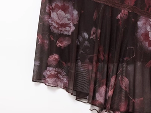 Detail of dark floral mesh fabric with elegant lace trim and vintage flower pattern