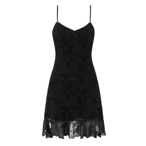 Detail of floral texture and mesh ruffle hem on black mini camisole dress