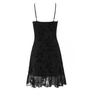 Detail of floral texture and delicate lace hem on this black mini camisole dress