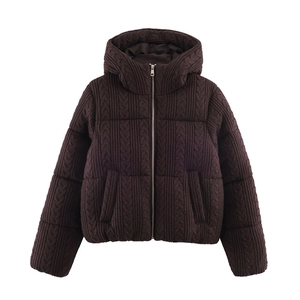 Close-up of deep brown cable knit texture and metal zipper on hooded winter puffer jacket