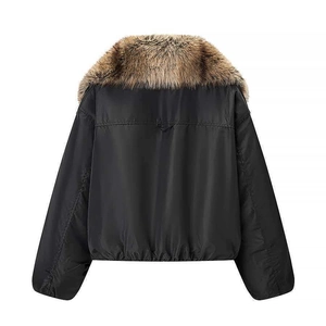 Close-up of the plush faux fur collar and back stitching on this black bomber jacket
