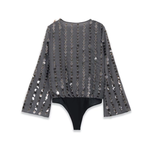 Detail of grey sequined bodysuit with sheer fabric and wide flared sleeves for party wear