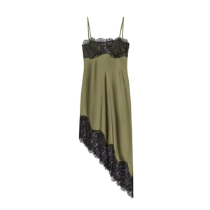 Detail of olive green satin dress featuring black lace trim and asymmetric hem design