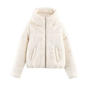 Detailed view of cream white cable-knit texture on winter hooded puffer jacket