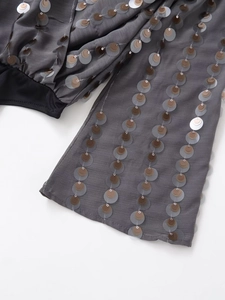 Detailed view of dark grey long sleeve bodysuit with vertical tri-color sequins decoration