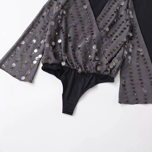 Sparkly sequin long sleeve bodysuit for women with deep V-neck and elegant flare sleeves