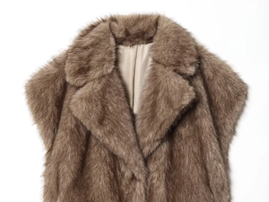 Detail shot of the plush faux fur texture and lapel design on this brown winter vest