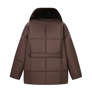 Close-up of brown quilted jacket back featuring large square stitching and fur collar