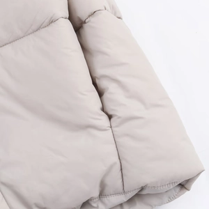 Women's minimalist winter hooded jacket in light beige with large square quilting pattern