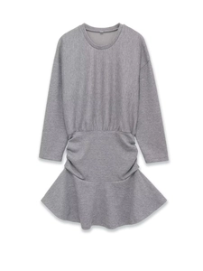 Detail of dark grey knit dress featuring ribbed texture and ruffled fishtail hemline