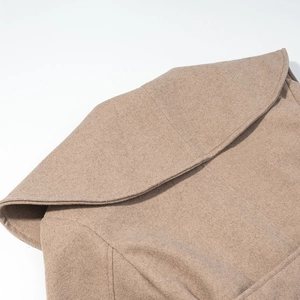 Detail view of premium wool coat collar and shoulder seams in oatmeal camel color