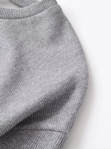 Detailed macro view of grey rib-knit dress collar with high-density fabric texture