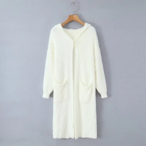 Detailed view of white hooded long cardigan featuring soft faux mink fur and large front pockets