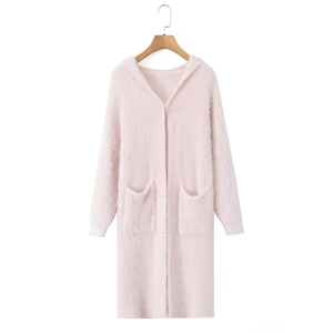 Detail of soft pink long hooded knit cardigan showing fuzzy plush fabric texture and pockets