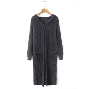 Close-up of long hooded grey plush cardigan featuring thick warm fabric and side pockets