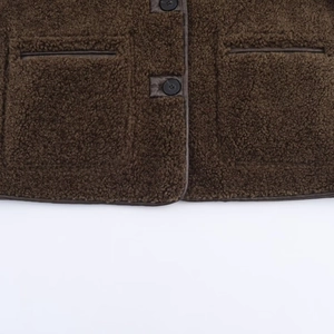 Women's dark brown reversible teddy jacket with leather trim pockets and button detail