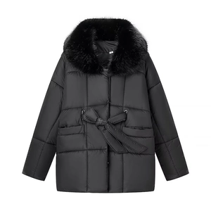 Women's black short quilted jacket featuring a large faux fur collar and waist tie belt