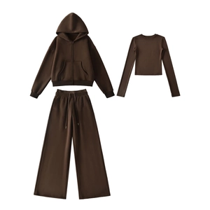 Detailed close-up of brown 3-piece loungewear set with hoodie, t-shirt and wide leg pants