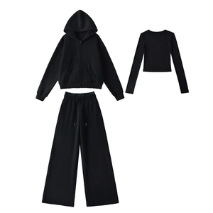 Flat lay of women's black 3-piece fleece tracksuit with hoodie and wide-leg pants