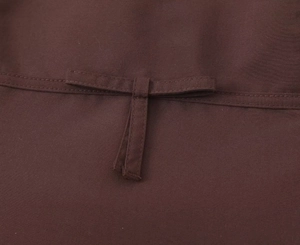 Close-up of the adjustable back strap and durable brown fabric on a women's strapless top