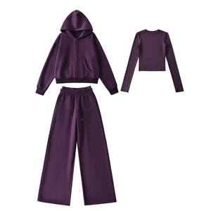 Detailed flat lay of a 3-piece thick dark purple tracksuit with hoodie and wide-leg pants