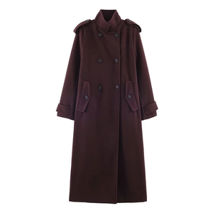 Detail of burgundy wool coat showing double-breasted buttons and military epaulettes
